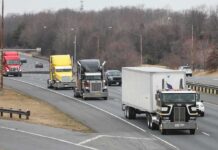 26,000 Trucks Off the Road—But Where’s the Proof? Convoy of semi trucks driving on a multi-lane highway