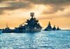 Sanctions Blitz Slams: Iran’s Oil Lifeline Under U.S. Fire Naval warships anchored in a harbor at sunset