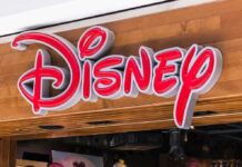 Disney store sign on wooden storefront