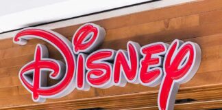 Disney store sign on wooden storefront
