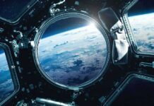 Earth seen through a spacecraft window