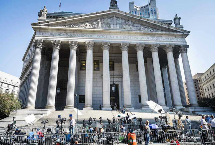 2445868619 Teddy Williams at courthouse steps with media outside a neoclassical building
