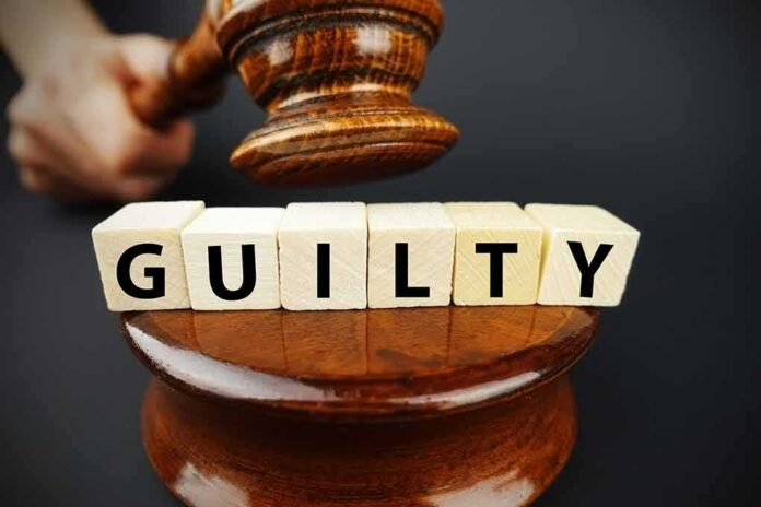 shutterstock_1014820045 Judge's gavel above blocks spelling guilty