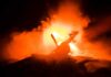 Helicopter Crashes in Chatsworth Toy helicopter silhouette against fiery explosion at night