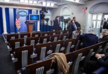 Trump Escalates the Iran Economic War White House press briefing room with empty seats and cameras