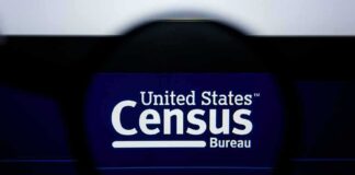 Magnifying glass over United States Census Bureau website