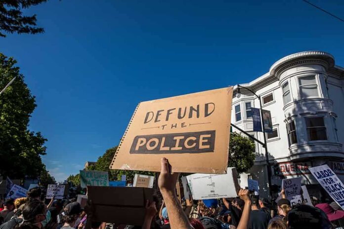 protesters holding signs at a street demonstration