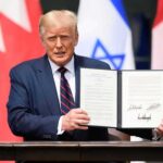 Four Exceptions — Massive Citizenship Fight Ahead Donald Trump holding a signed document at a ceremony