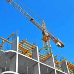 Skyscraper On Jacks: Construction Disaster Shuts Down Midtown Tower crane over concrete building under construction