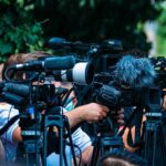 Malibu Sinkhole Threatens Million-Dollar Homes TV news cameras crowding together at an outdoor event