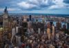 Gen Z Bolt: New York-to-Philly Migration Grows City skyline at dusk with river and dense skyscrapers
