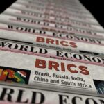 Stack of newspapers highlighting BRICS and world economy