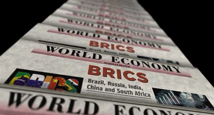 Stack of newspapers highlighting BRICS and world economy