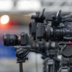 Mystery Illness Silences YMCA Voice Professional video cameras on tripods