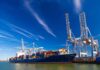 Iran Receives 1,300 Reported Shipments Container ship docked at port with cranes loading cargo