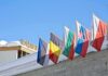 New Greenland Security Pact Signed Row of national flags on a snowy building facade