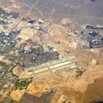 Phoenix Just Hit a Blistering 118° Aerial view of desert city with airport and highways