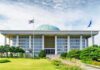 Iran Warns South Korea Over Hormuz Mission Parliament building with a green dome and flagpoles