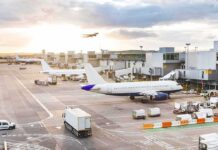 Pilot Attacked Captain Mid-Flight Airplanes at airport gates during sunset with ground vehicles and jet bridges