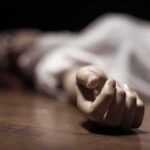 Fashion Designer Couple Shot Dead hand of a person lying on the floor