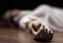 Fashion Designer Couple Shot Dead hand of a person lying on the floor