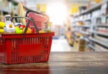 Michigan Senate Race Faces Ad Controversy Red shopping basket filled with groceries on a store aisle