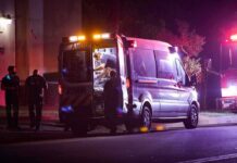 Head Injury Follows Tampa Fall Ambulance at night with paramedics attending a patient