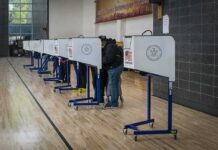 DOJ Appeal Reignites California Ballot Fight Voters at polling booths in a gymnasium