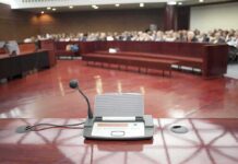 UFO Claims vs. Pentagon Findings Conference microphone on a podium in a courtroom