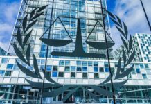 Hidden Camera Case Ends in 90-Year Prison Term Scales of justice emblem on glass facade of modern office building