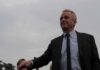 $780K U.S. Grant Linked to Russian Plague Research Robert F. Kennedy Jr. in a suit outdoors