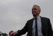 $780K U.S. Grant Linked to Russian Plague Research Robert F. Kennedy Jr. in a suit outdoors