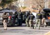 72-Year-Old Homeowner Faces No Charges After Shooting Police and sheriff officers gather around vehicles on a suburban street