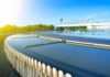 Circular wastewater treatment clarifier with overflow weirs