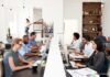 Polling Bias Raises Doubts About a Blue Wave Office workers at shared desks using desktop computers