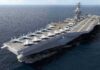 Navy Reconsiders Smaller Carriers Aircraft carrier at sea with fighter jets on deck