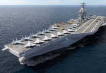 Navy Reconsiders Smaller Carriers Aircraft carrier at sea with fighter jets on deck