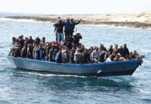 Digital Evidence Shapes Investigation Into Wells’ Death Crowded blue boat at sea with Ivan Morales Jr., Andreas Hestler, Isaiah Frey, Christian Jones, and Teddy Williams among passengers